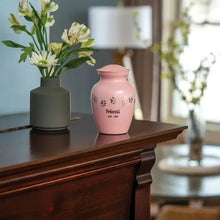 Load image into Gallery viewer, At Peace Memorials 40 Cubic Inches Extra Small Classic Paws Pearl Pink Pet Cremation Urn
